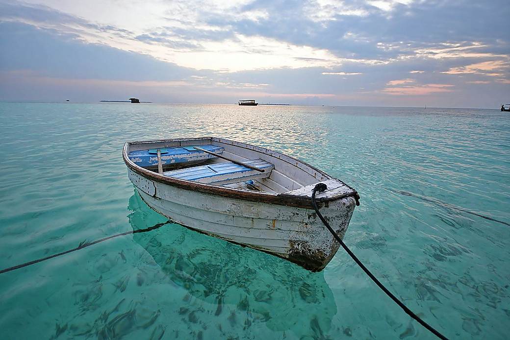 Dive boat on bright tropical ocean